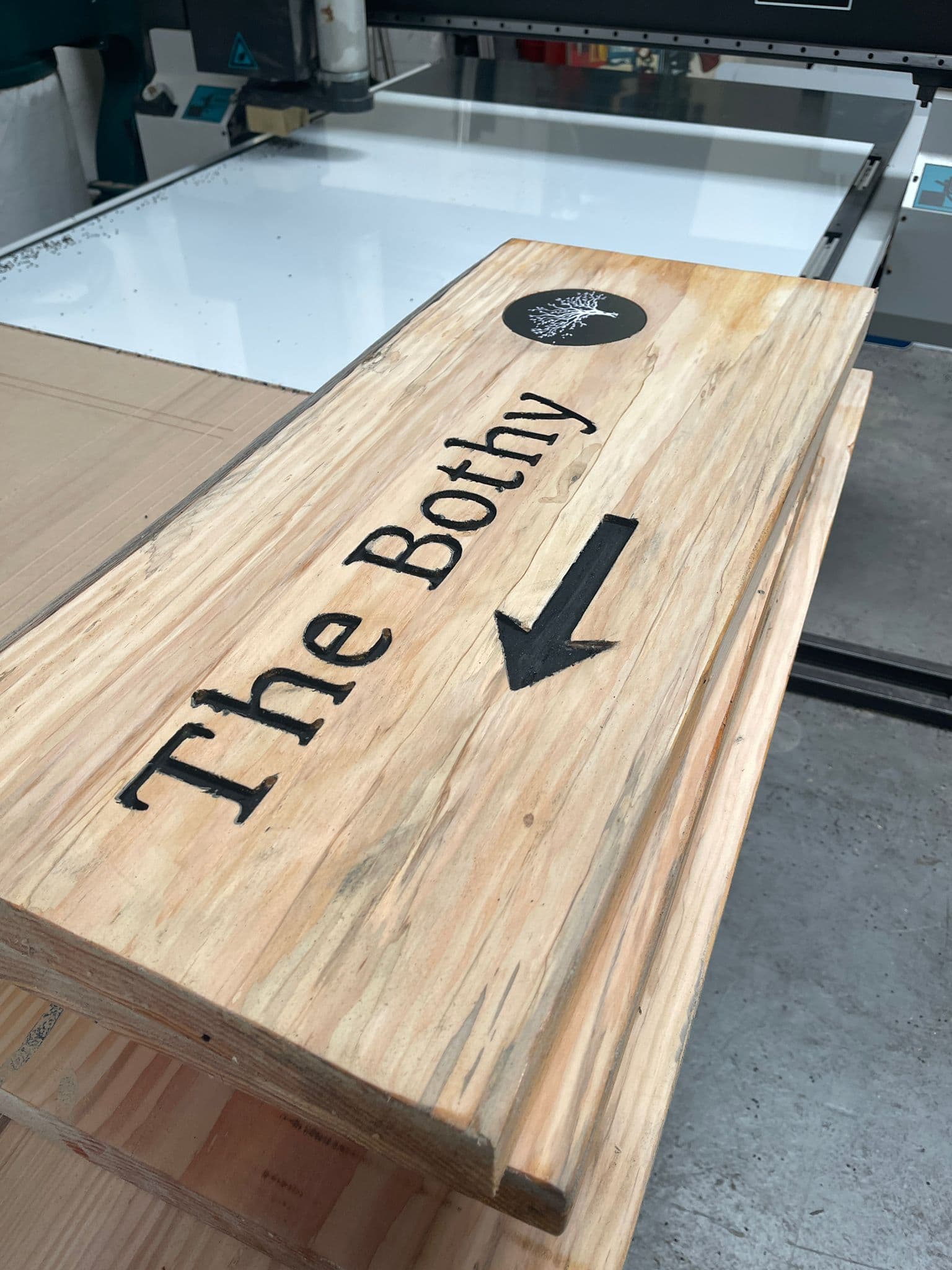 Bespoke The Bothy carved wooden directional sign on the VinylFX CNC bench